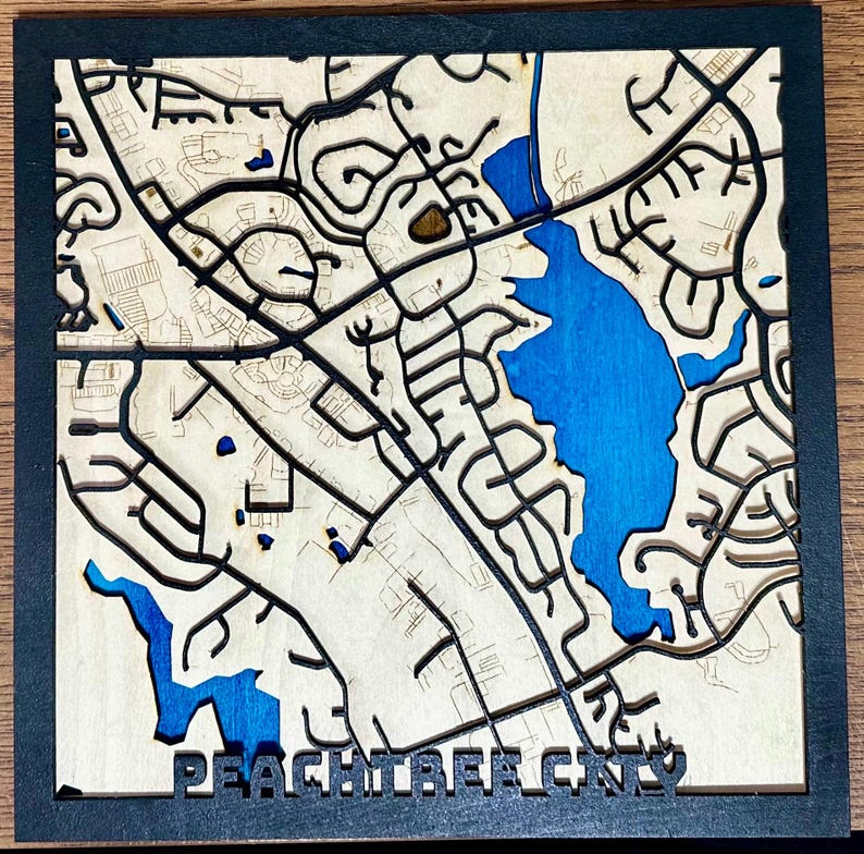 Peachtree City map with blue lakes and raised black roads
